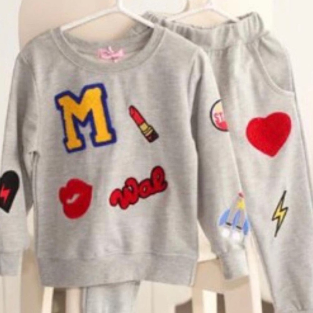 Girls Two-Piece Crème Joggers Set. Size 3T-5T available
